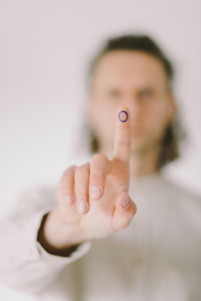 pexels-photo-6942246-6942246 Focused shot of a hand showing a diabetes awareness symbol on the finger.