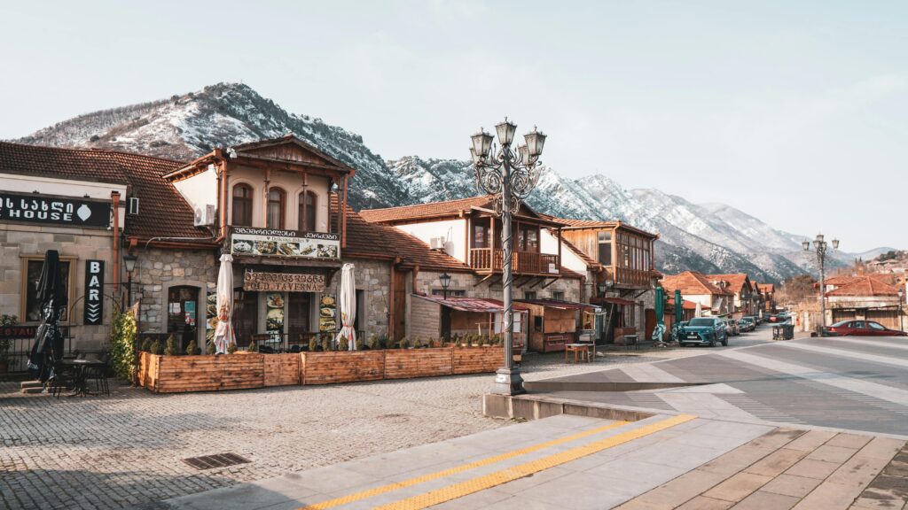 pexels-photo-20178328-20178328 Quaint street in Mtskheta with scenic mountain backdrop, vibrant architecture, and a peaceful atmosphere.