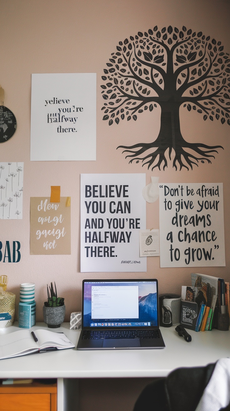 A dorm desk featuring a laptop, notebooks, and a colorful wall art display with motivational quotes and a tree design.